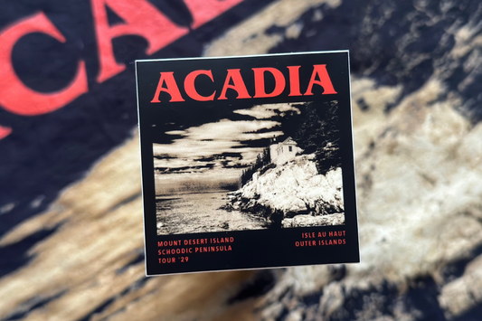 Acadia National Park sticker with scenic image and text on a blurred background