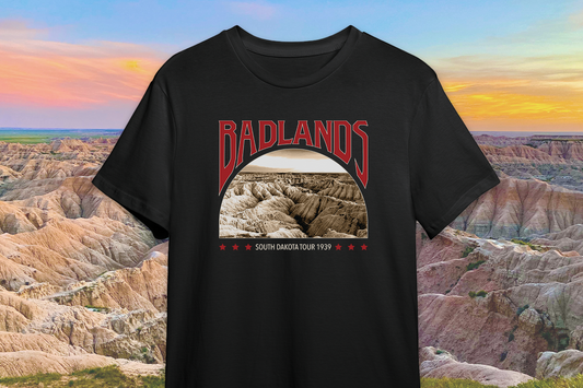 Black t-shirt with Badlands National Park graphic against a Badlands landscape