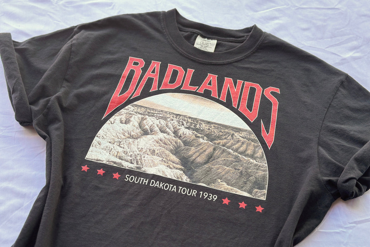 Black t-shirt with 'Badlands' graphic and text on a white background