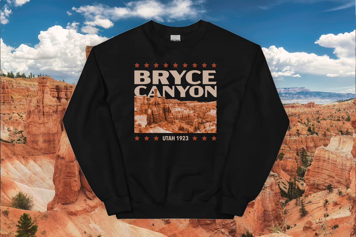 Black sweatshirt with Bryce Canyon design against a backdrop of Bryce Canyon National Park.