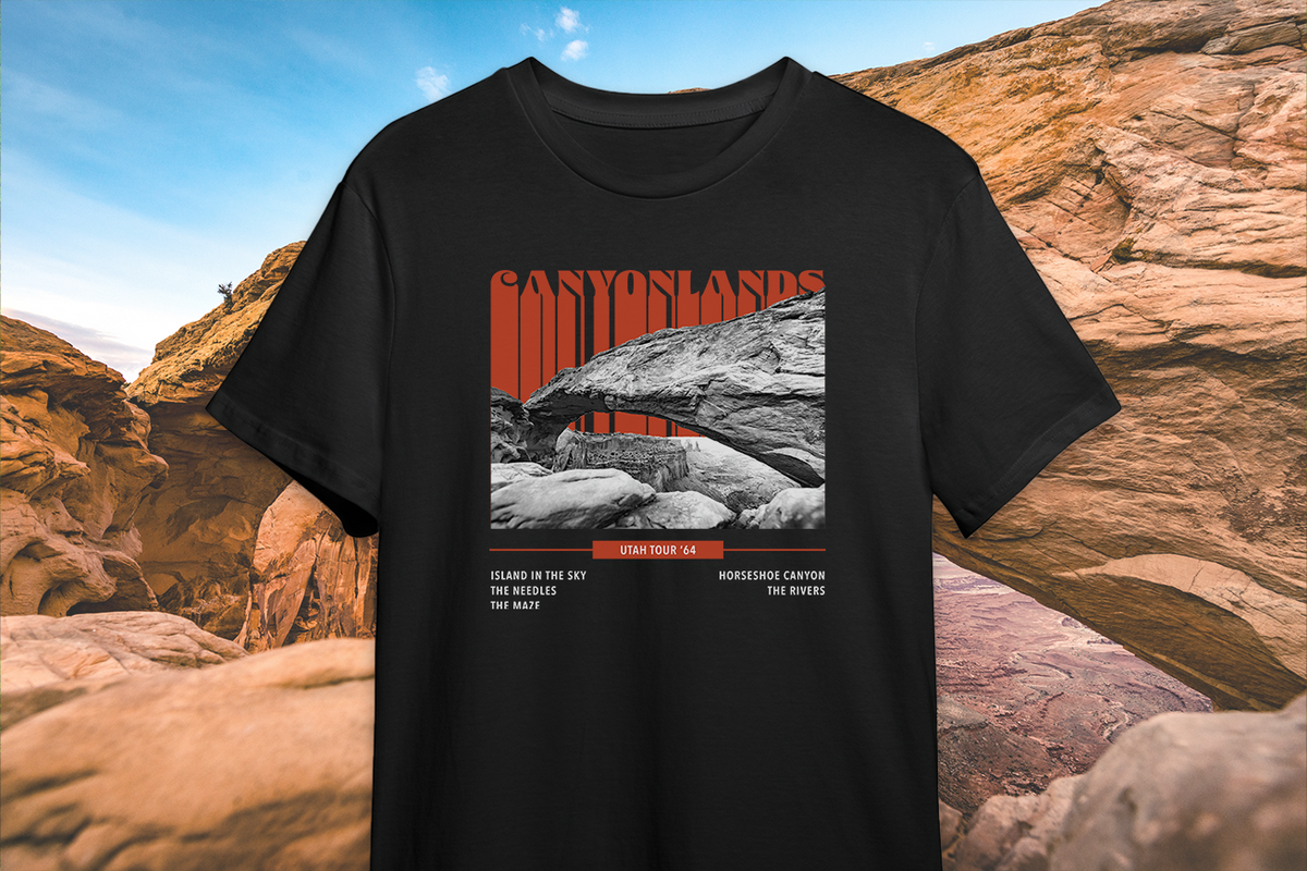 Black t-shirt with a 'Canyonlands' graphic design of a canyon on a rocky landscape background