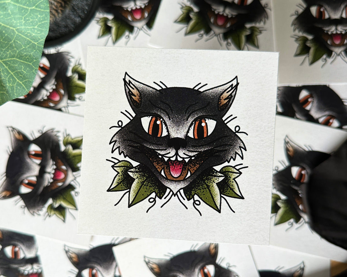 An illustration of a black cat, with more art pints in the background.