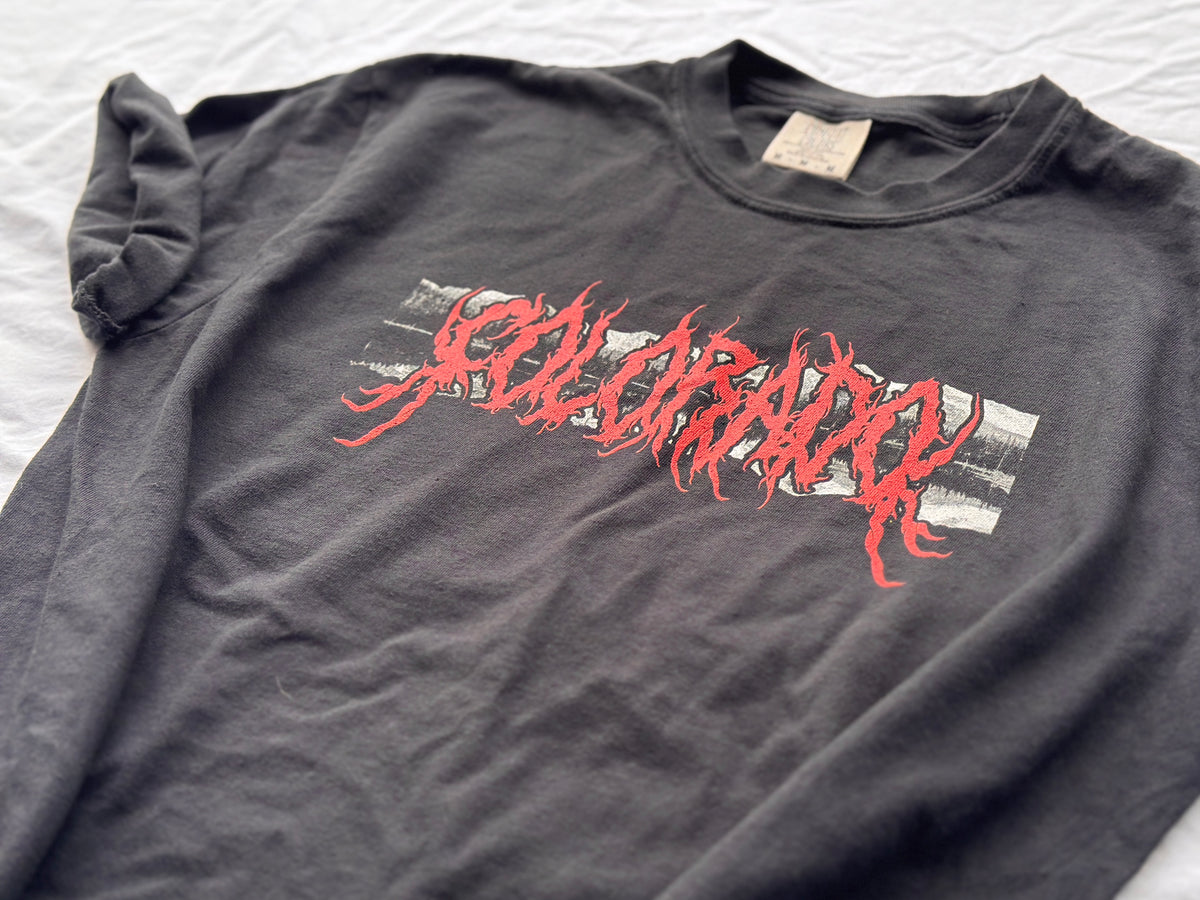 A black t-shirt with the word 'Colorado' printed in red and white on the front.