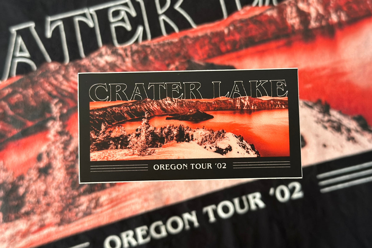 Black sticker with a 'Crater Lake' graphic design, on a textured background
