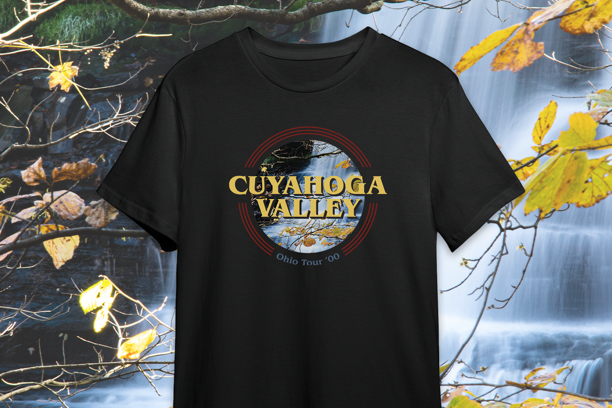 Black t-shirt with 'Cuyahoga Valley' design against a nature-themed background