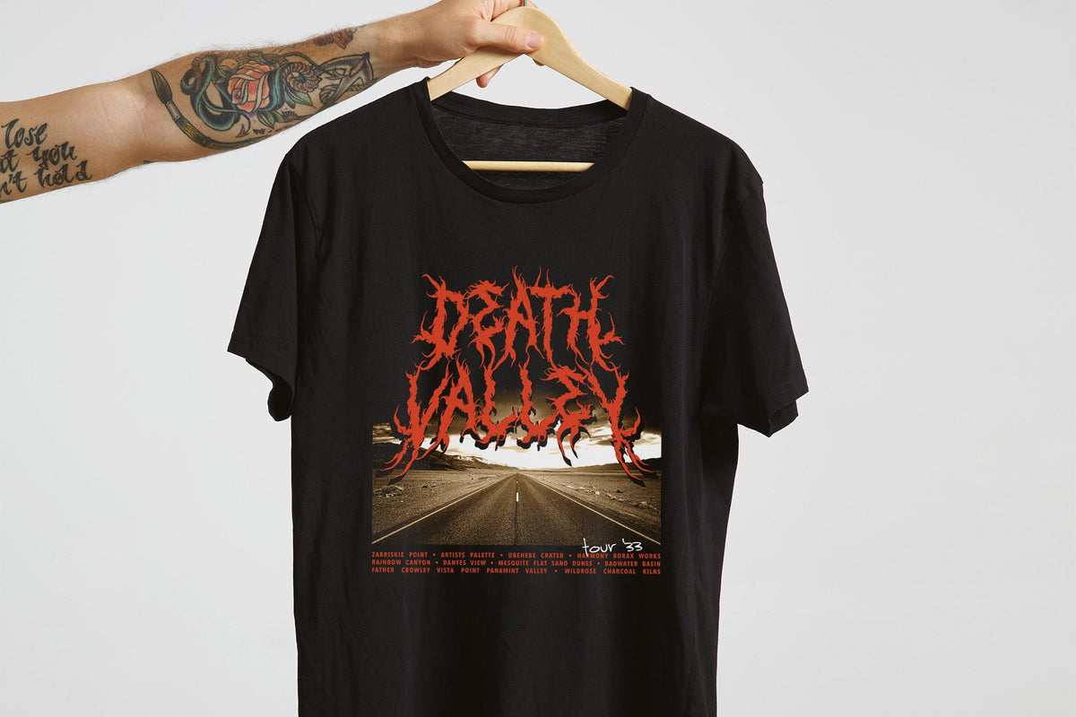 Black t-shirt with 'Death Valley' graphic design on a hanger against a white background
