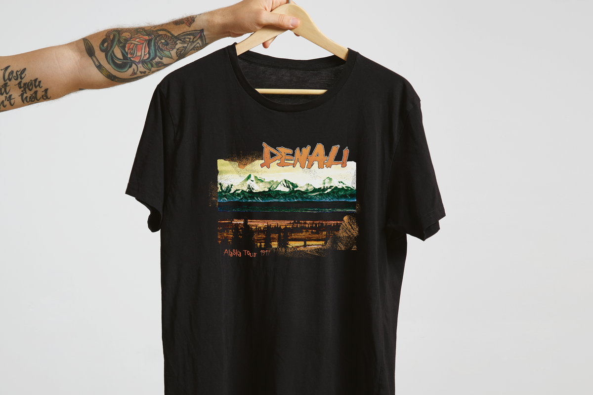 Black t-shirt with a mountain graphic and 'Delaware' text on a hanger against a white background