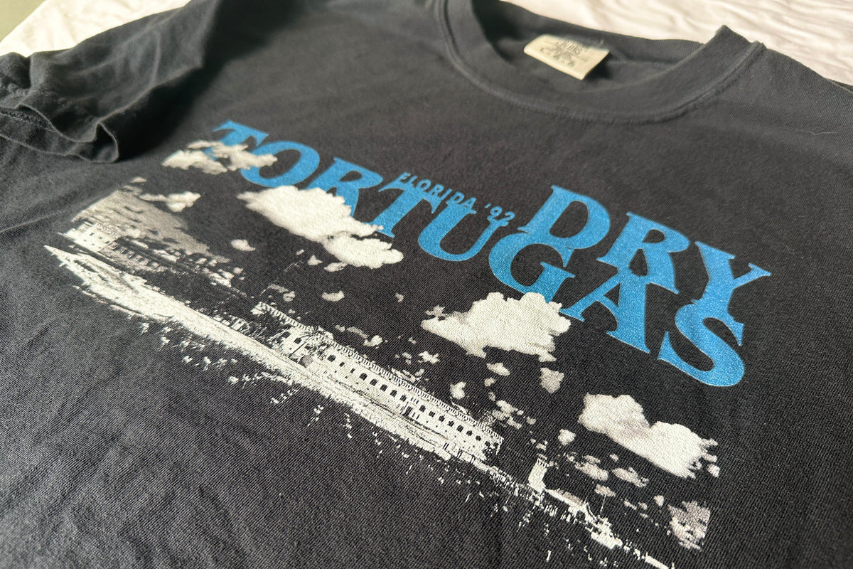 Black t-shirt with 'Dry Tortugas' text and graphic design on a plain background