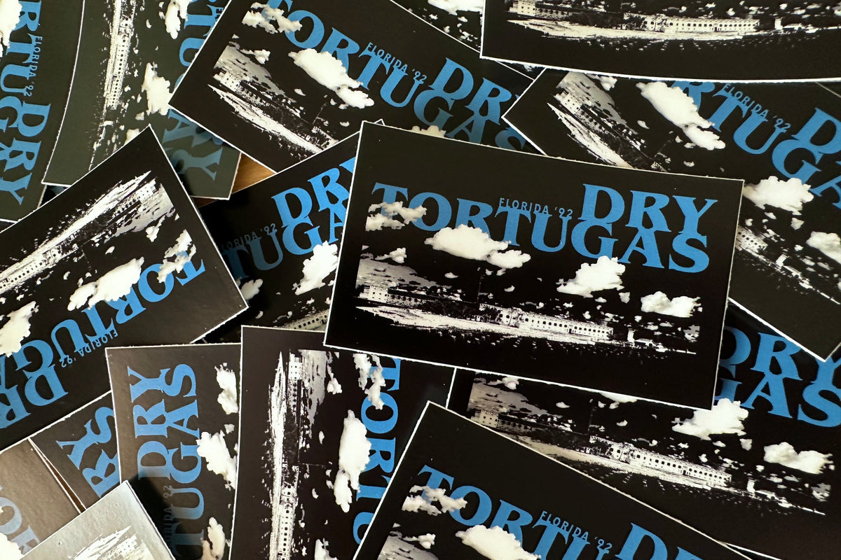 Collection of 'Dry Tortugas' stickers with black and white images and blue text.