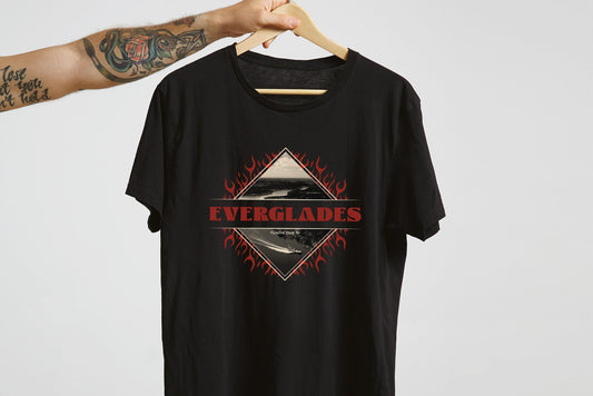 Black t-shirt with 'Everglades' graphic on a hanger against a light gray background