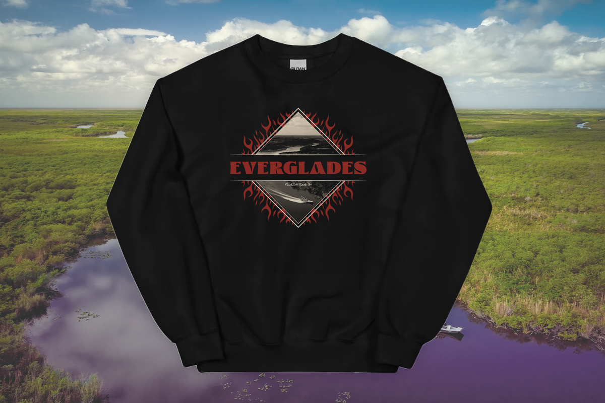 Black sweatshirt with 'Everglades' design on a scenic background of water and greenery