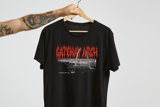 Black t-shirt with 'Gateway Arch' design on a hanger against a white background