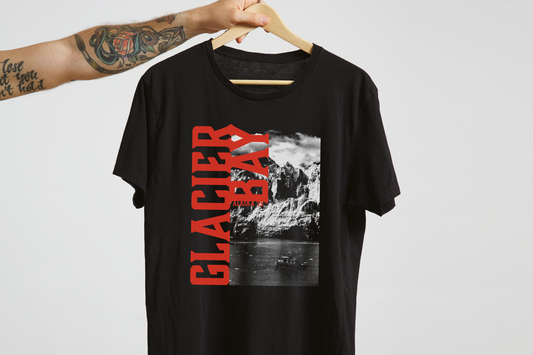 Black t-shirt with 'Glacier Bay' graphic design on a hanger against a white background