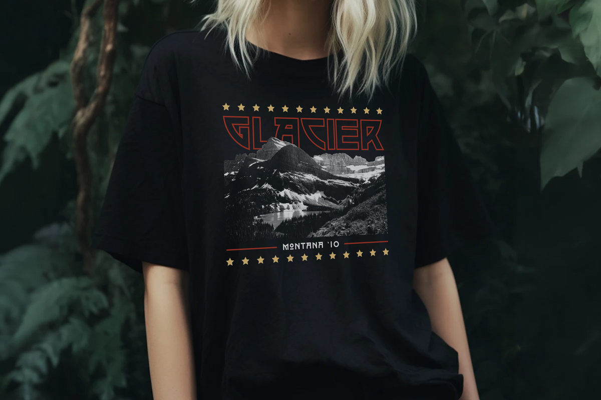 Person wearing a black t-shirt with a 'Glacier' graphic design of a mountain and text.