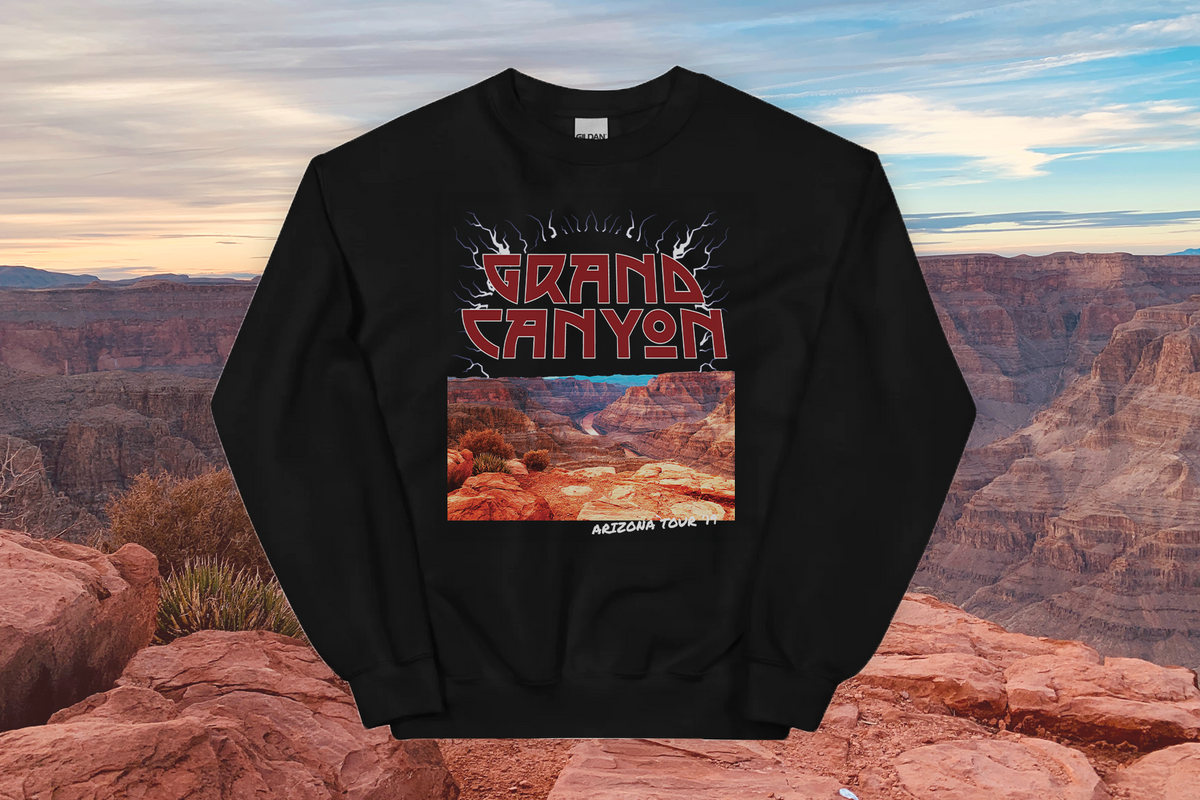 Black sweatshirt with Grand Canyon design against a backdrop of the Grand Canyon