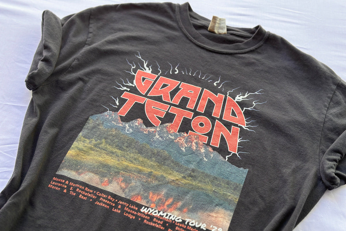 Black t-shirt with 'Grand Teton' graphic design on a white background