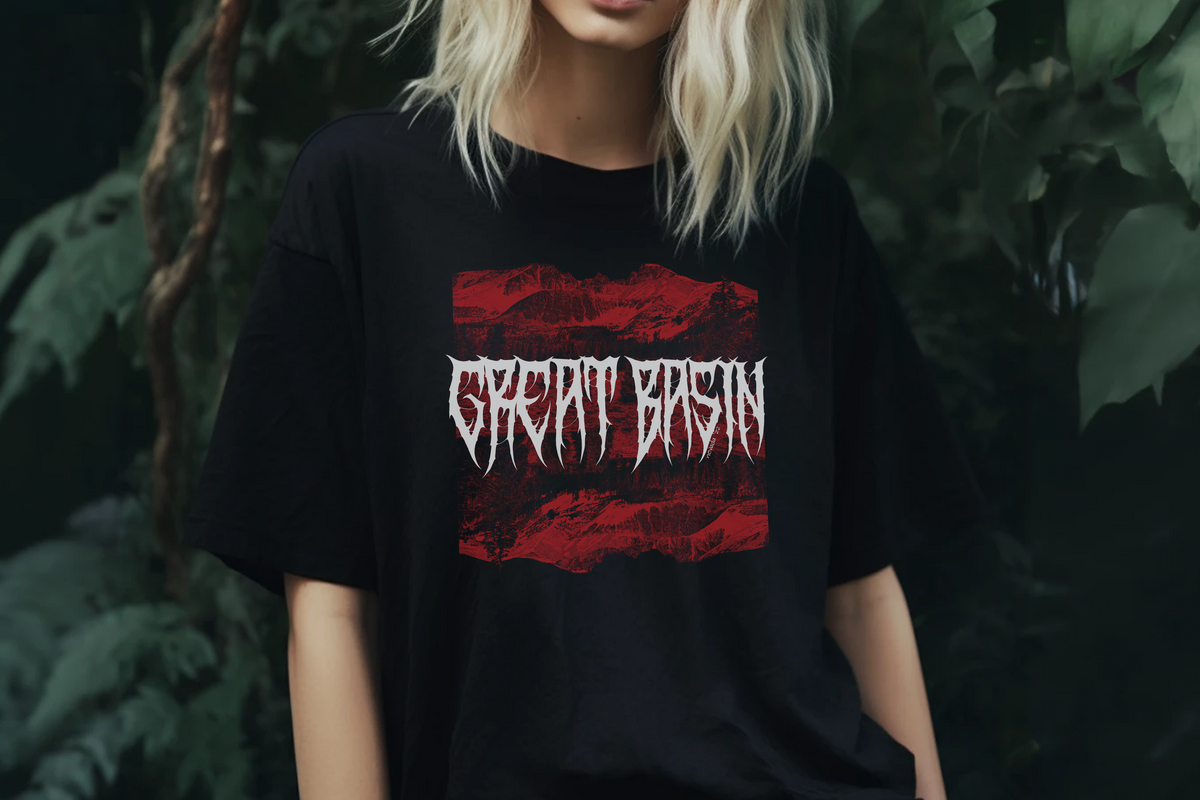 Person wearing a black t-shirt with 'Great Basin' design in red and white against a dark background