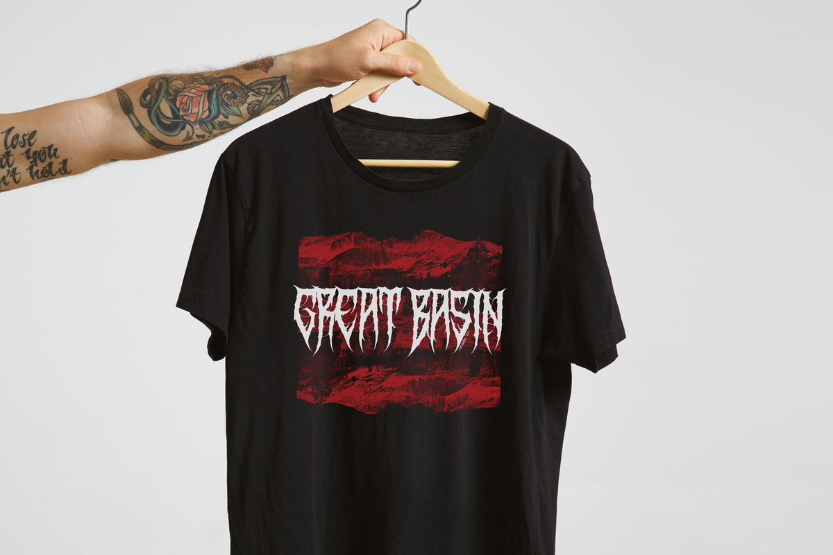 Black t-shirt with red and white 'Great Basin' graphic design on a hanger against a light gray background