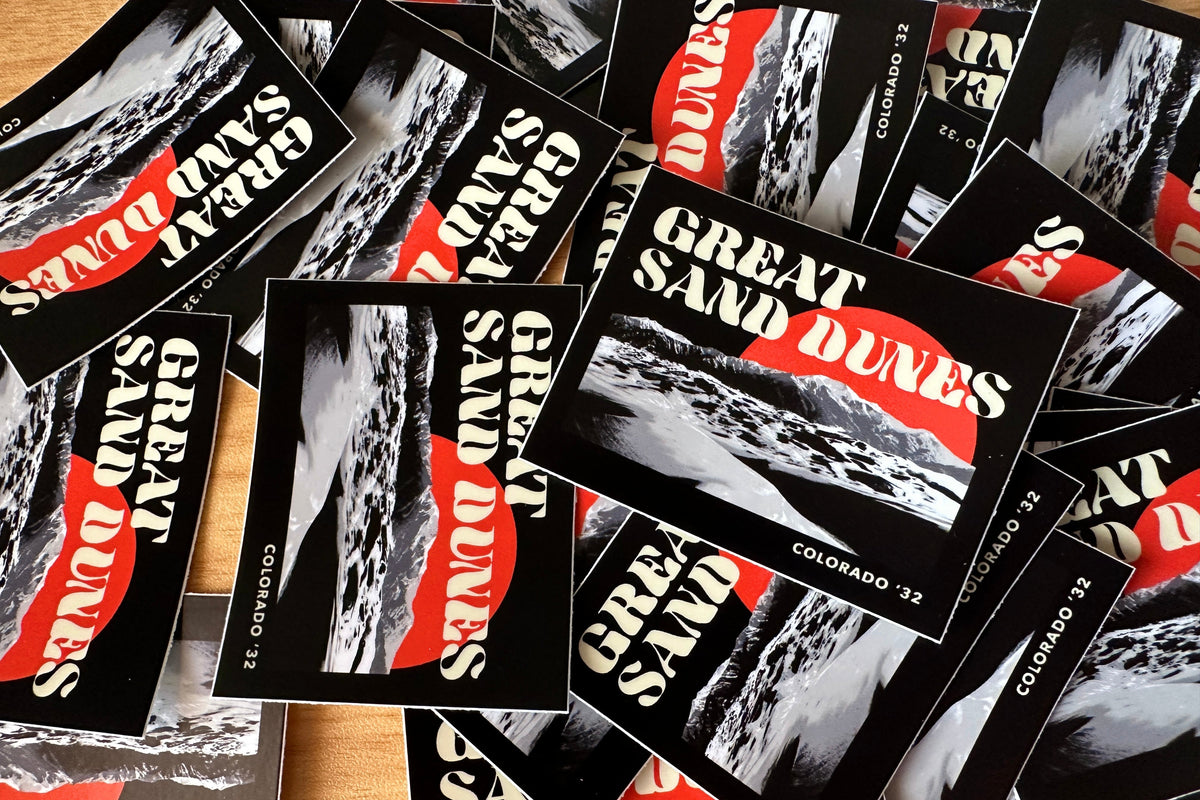 Collection of Great Sand Dunes stickers with black, white, and orange design.