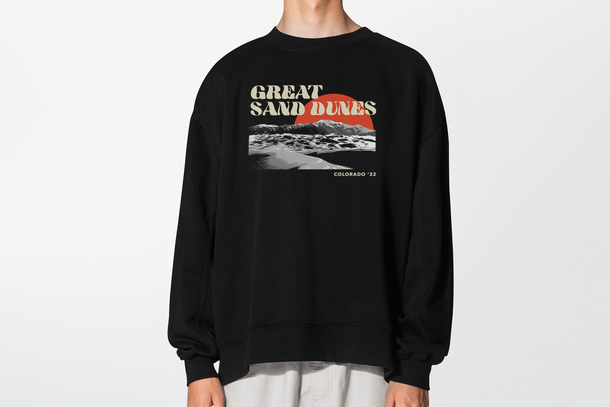Black sweatshirt with 'Great Sand Dunes' graphic design on a white background