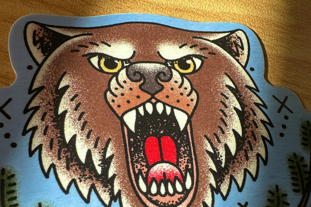 Stylized illustration of a bear with open mouth on a blue background