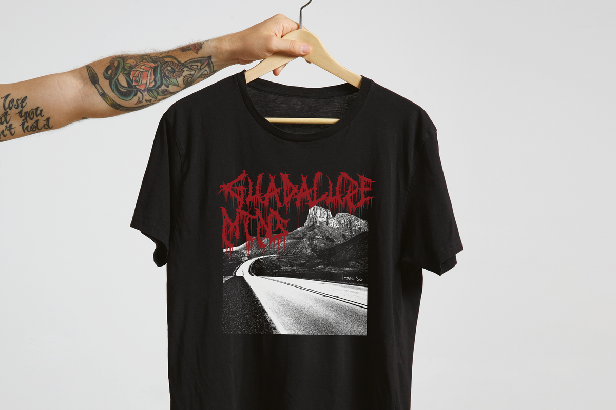 Black t-shirt with 'Guadalupe Mountains' graphic design and text on a white background