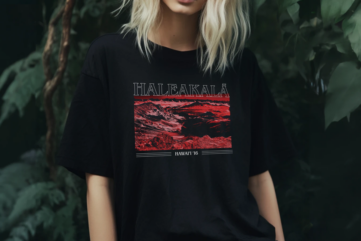 Person wearing a black t-shirt with Haleakala graphic design in red and white.