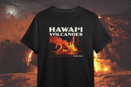 A black t-shirt with a 'Hawai'i Volcanoes' graphic design, in front of a volcano background