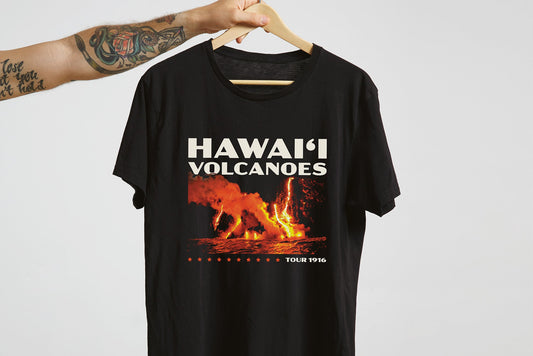 Black t-shirt with 'Hawaii Volcanoes National Park' graphic on a hanger against a white background