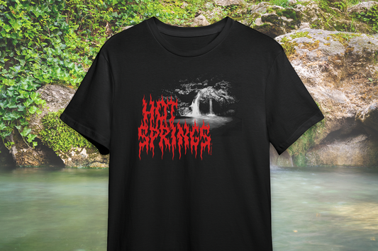 Black t-shirt with red text 'Hot Springs' against a natural background