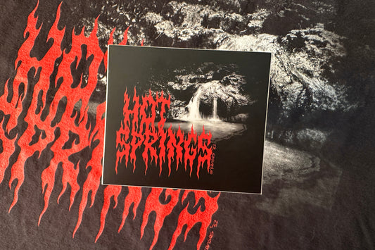 Hot Springs sticker on a textured background.