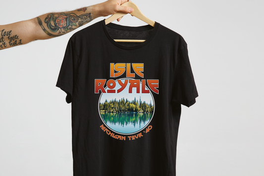 Black t-shirt with 'Isle Royale Michigan Tour' graphic on a hanger against a white background