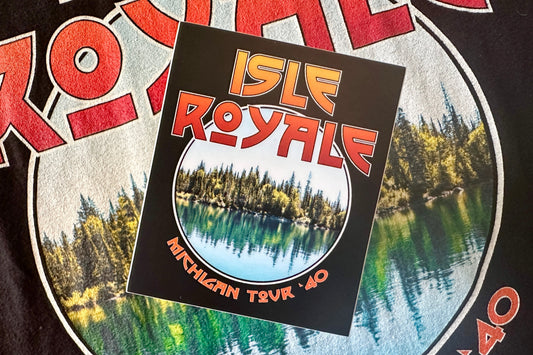 Sticker with 'Isle Royale' design, on a textured background.