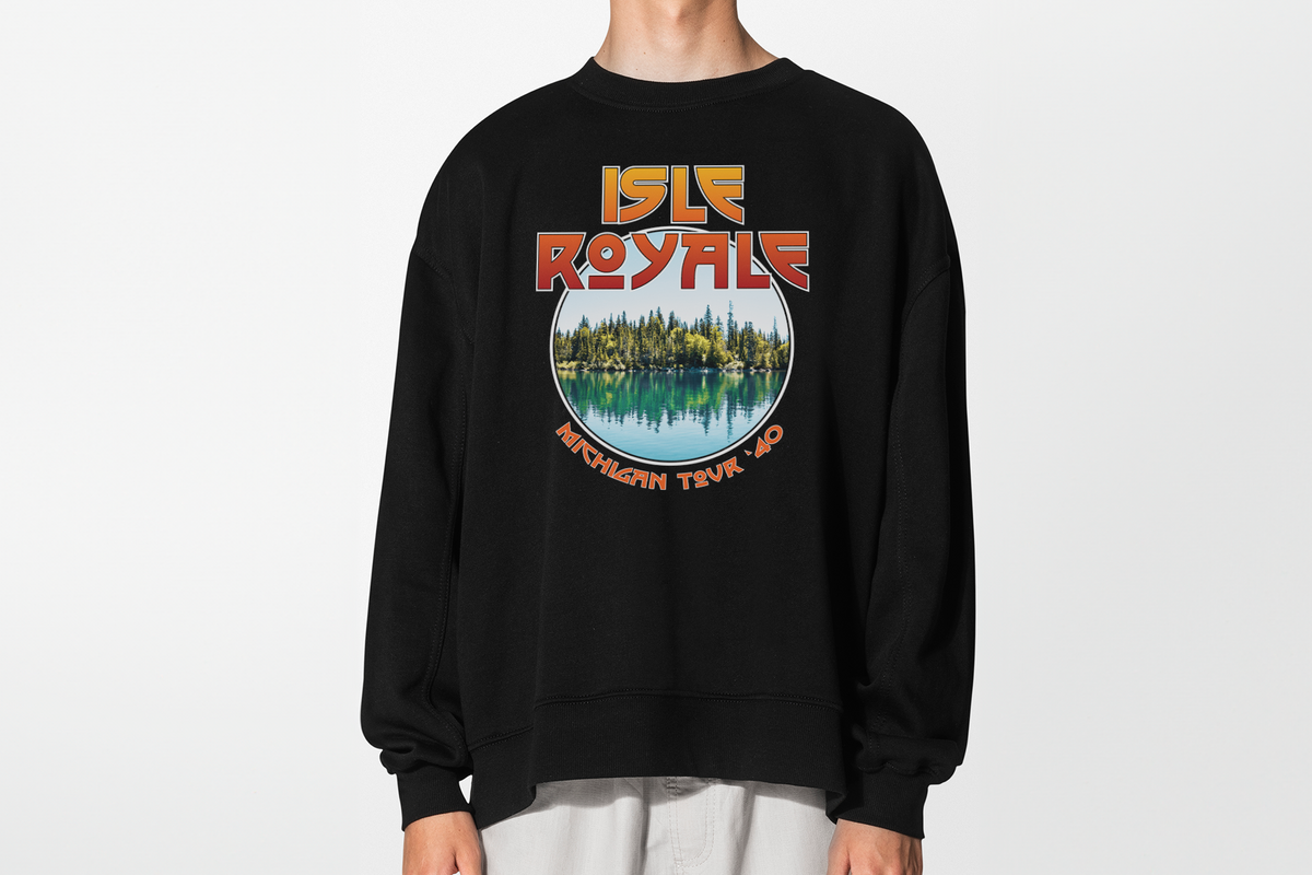 A person wearing a black sweatshirt with 'Isle Royale' design, in front of a white background