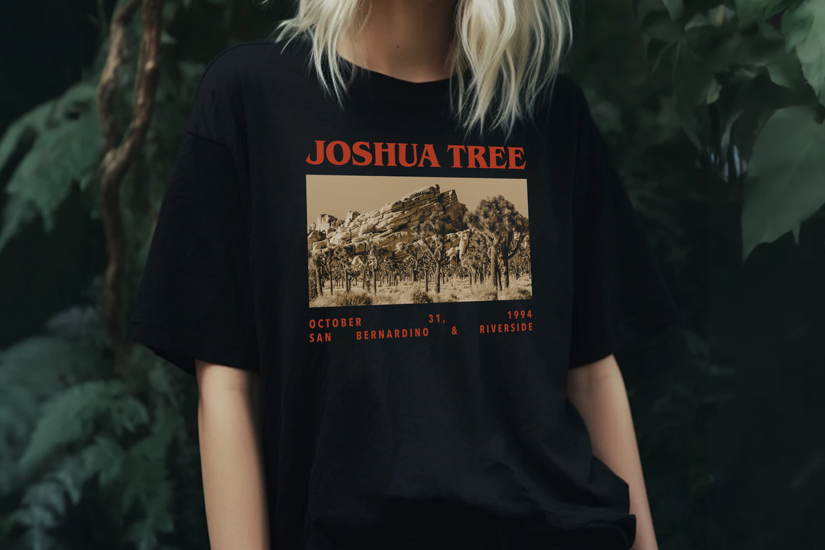 Black t-shirt with 'Joshua Tree' graphic design worn by a person against a dark background