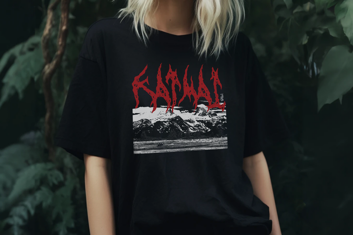 Person wearing a black t-shirt with a 'Katmai' graphic design and text, standing against a dark background.
