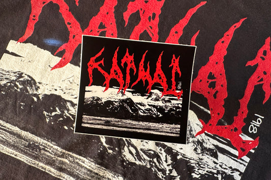 A black and white photo of mountains with red text.