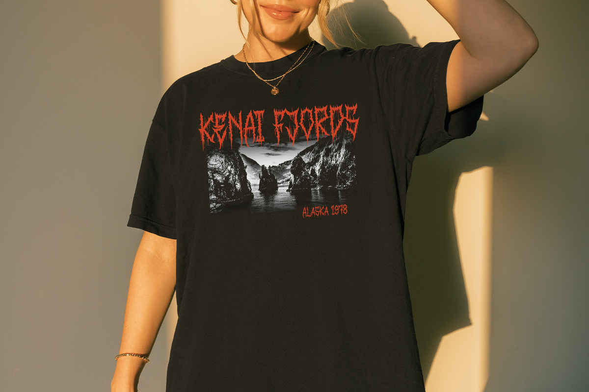 Person wearing a black t-shirt with Kenai Fjords Alaska design