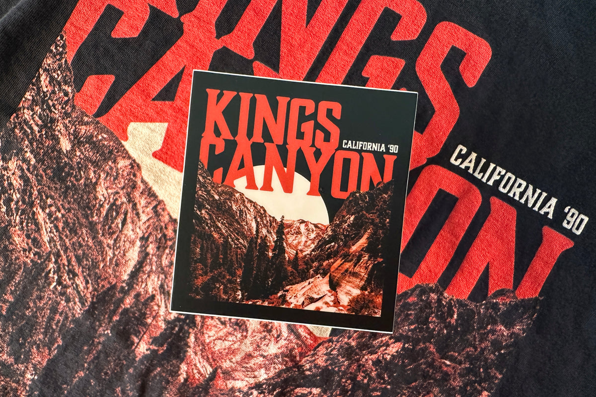 Sticker with 'Kings Canyon' design on a textured surface.