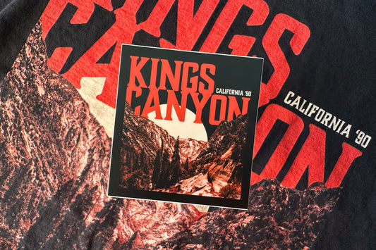 Sticker with 'Kings Canyon' design on a textured surface.