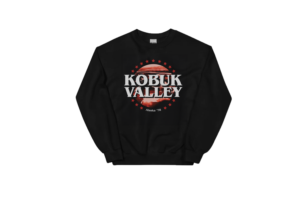 A black sweatshirt with a red and white 'Kobuk Valley' graphic, on a white background