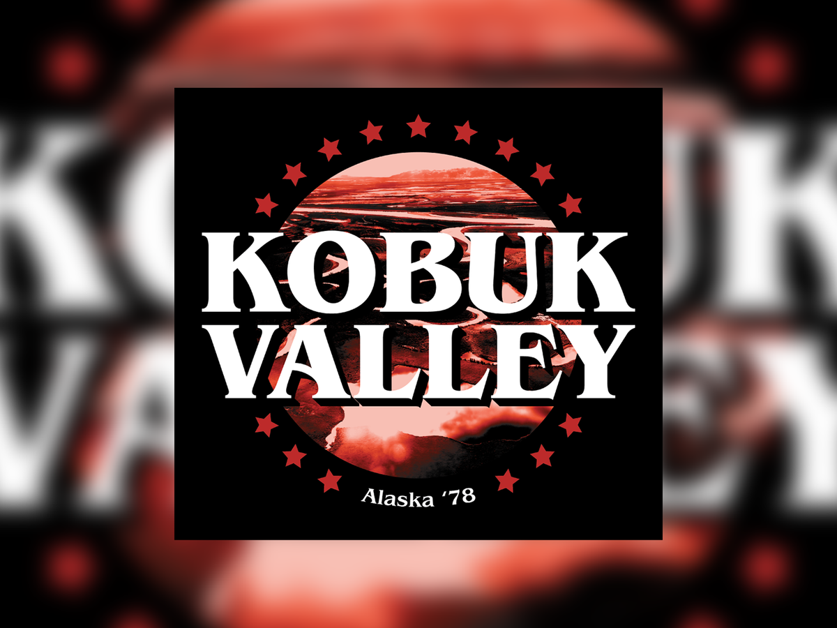 A square sticker with the words 'KOBUK VALLEY' in large white letters over a circular red-and-black landscape image, with 'Alaska '78' below. The square is centered on a blurred red-and-white background with the same text partially visible behind it.