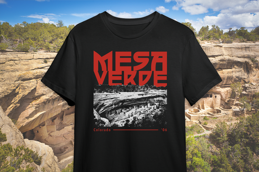 Black t-shirt with 'Mesa Verde' design in front of a scenic background