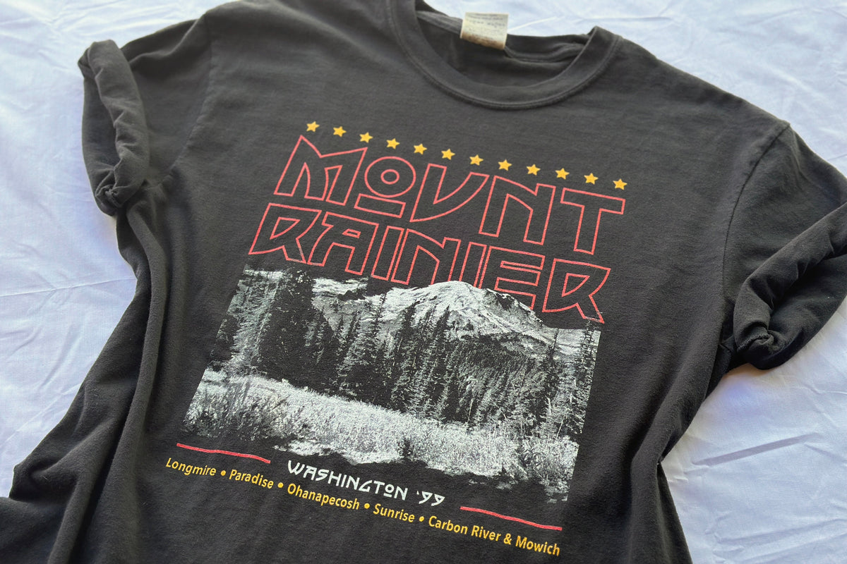 Black t-shirt with Mount Rainier graphic and text on a white background