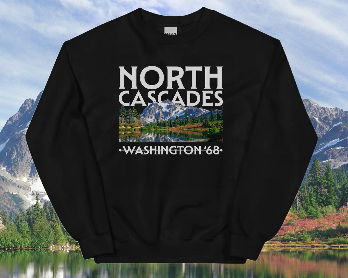 Black sweatshirt with a 'North Cascades' design in front of a scenic background.