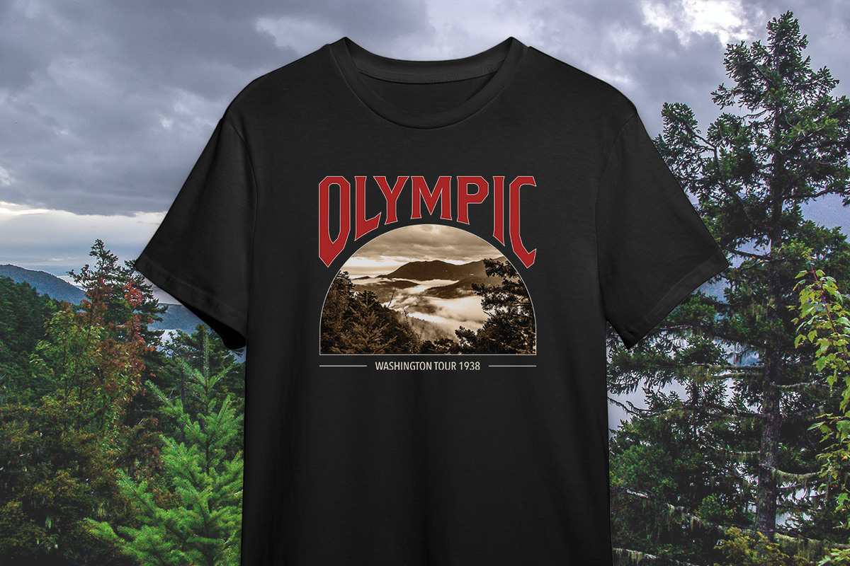 Black t-shirt with Olympic graphic design against a natural background