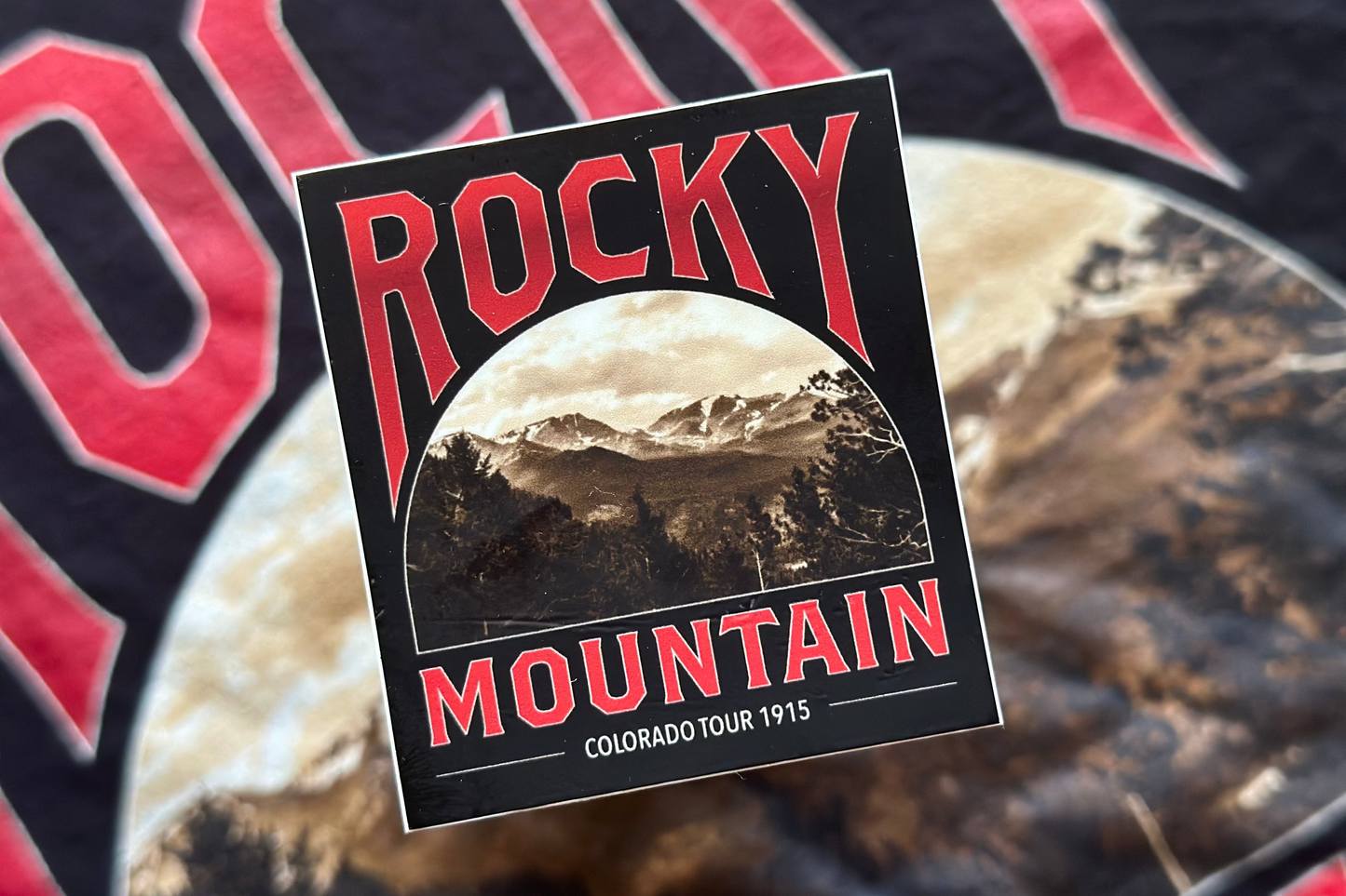 Sticker with 'Rocky Mountain'' design on a blurred background 