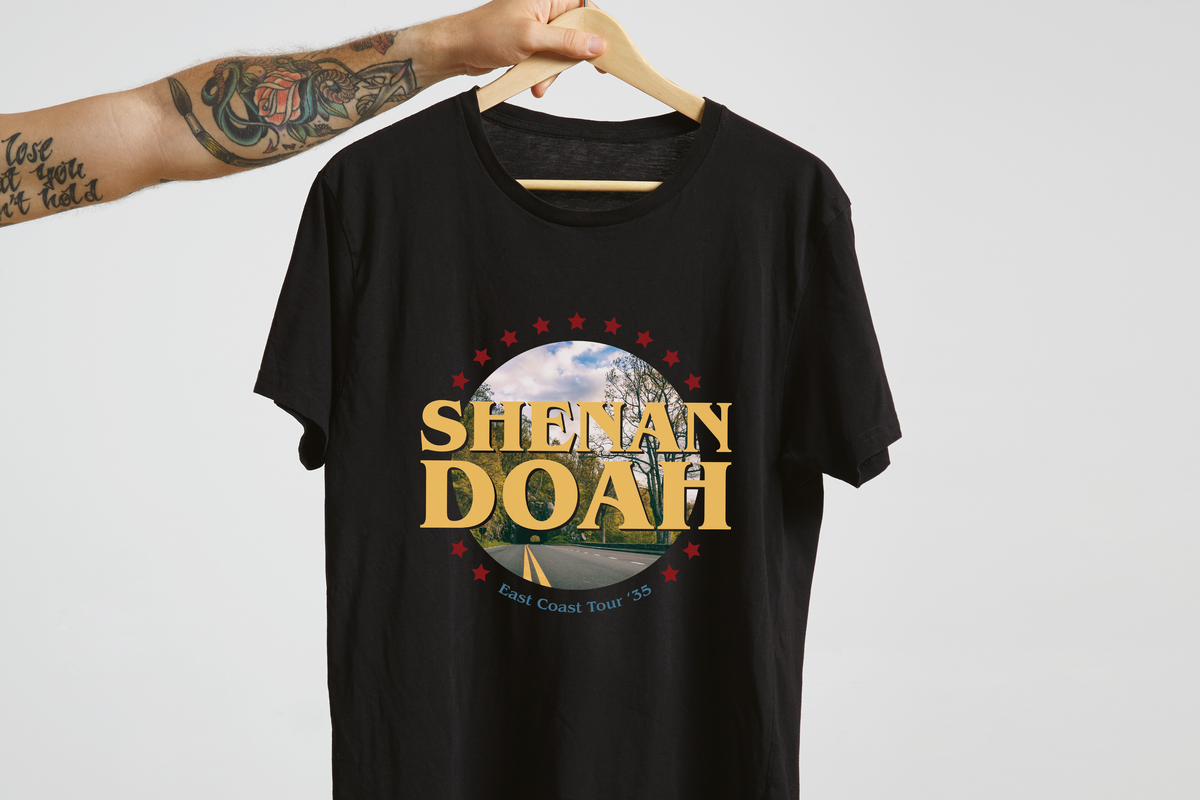 Black t-shirt with 'Shenandoah' graphic design on a hanger against a light gray background