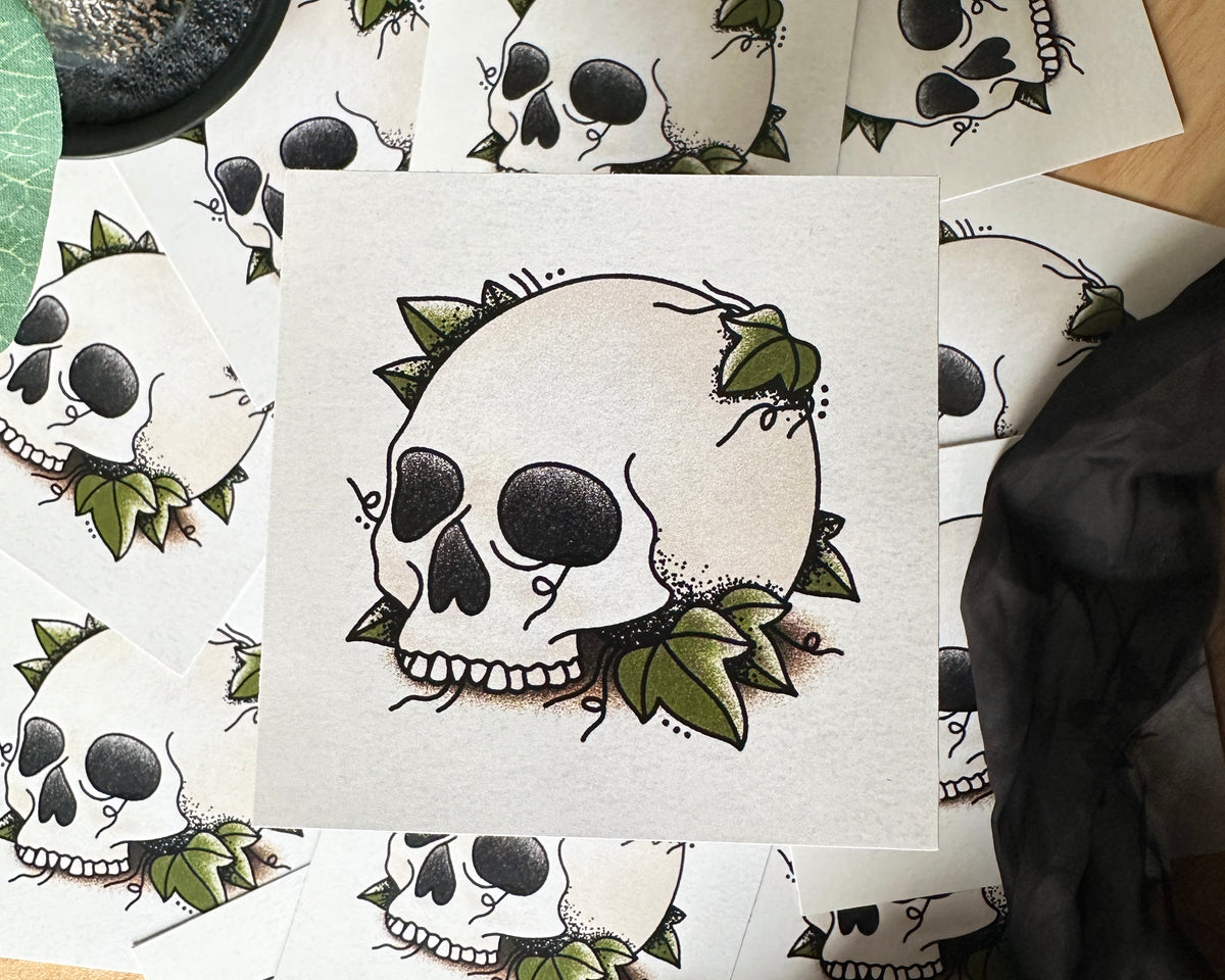 An illustration of a skull with more art prints in the background
