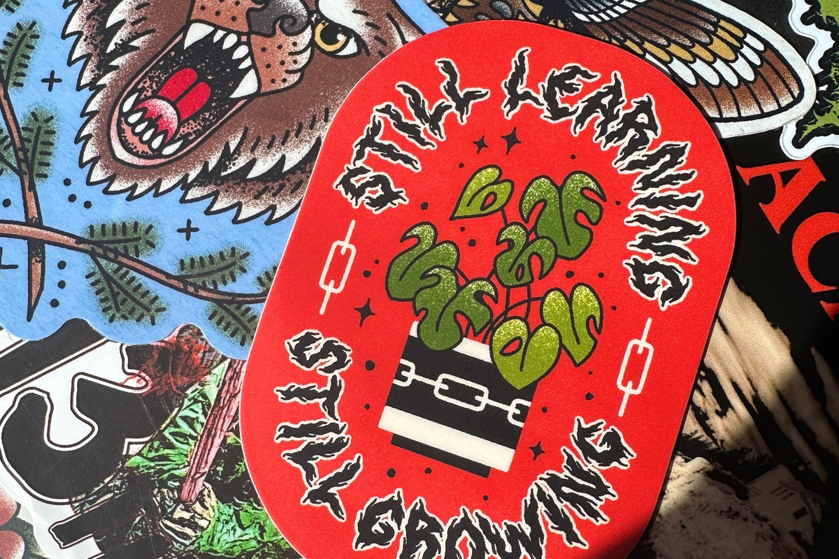 Sticker with graphic design and text on a colorful background
